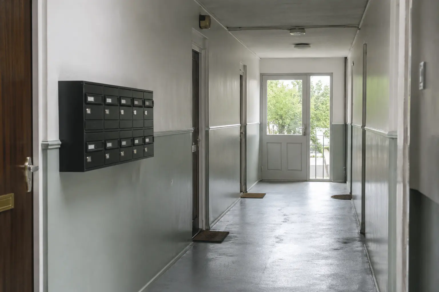 A communal entrance hallway in a rented apartment building